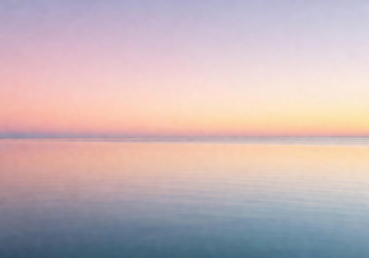 Tranquil ocean horizon with soft pastel sky